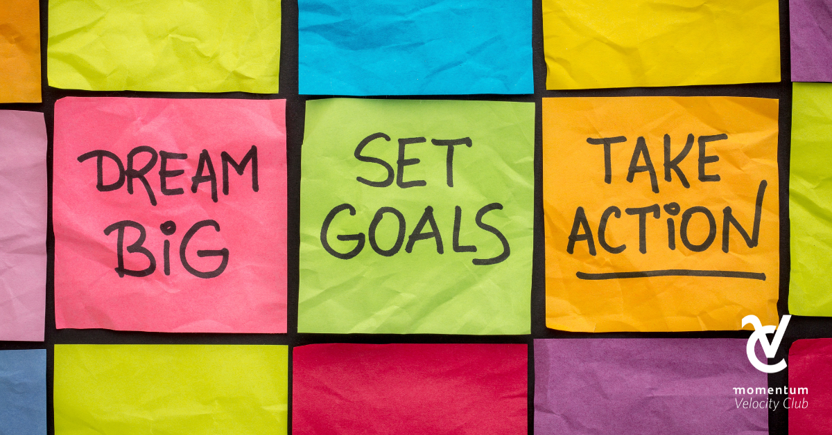 Post-it notes in different colours with the words dream big, set goals, and TAKE ACTION written on them.