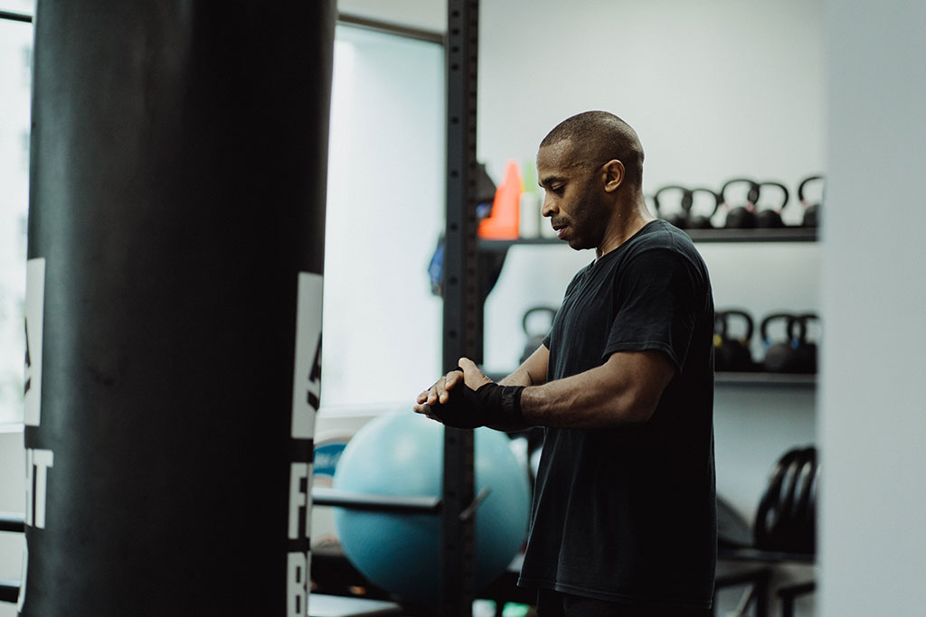 Young African man getting ready for a workout at the gym