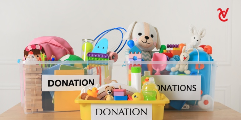 3 buckets filled with children's toys for donation.