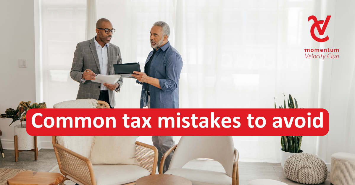 A man discusses common tax mistakes to avoid with a Momentum Velocity Club consultant.