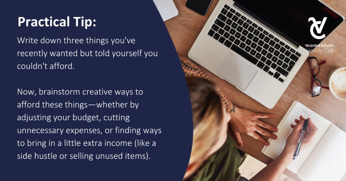 A woman with her laptop in front of her and writing creative ways to cut her expenses in her notebook.