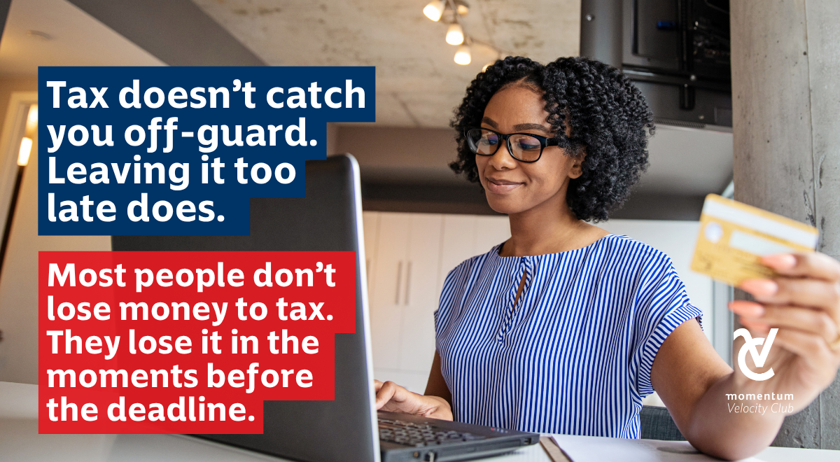 A woman smiling while using a laptop preparing early for tax season to avoid last-minute losses.