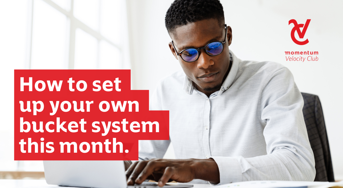 :  An African male professional, at his laptop, planning his monthly finances by applying the bucket system into his budgeting.