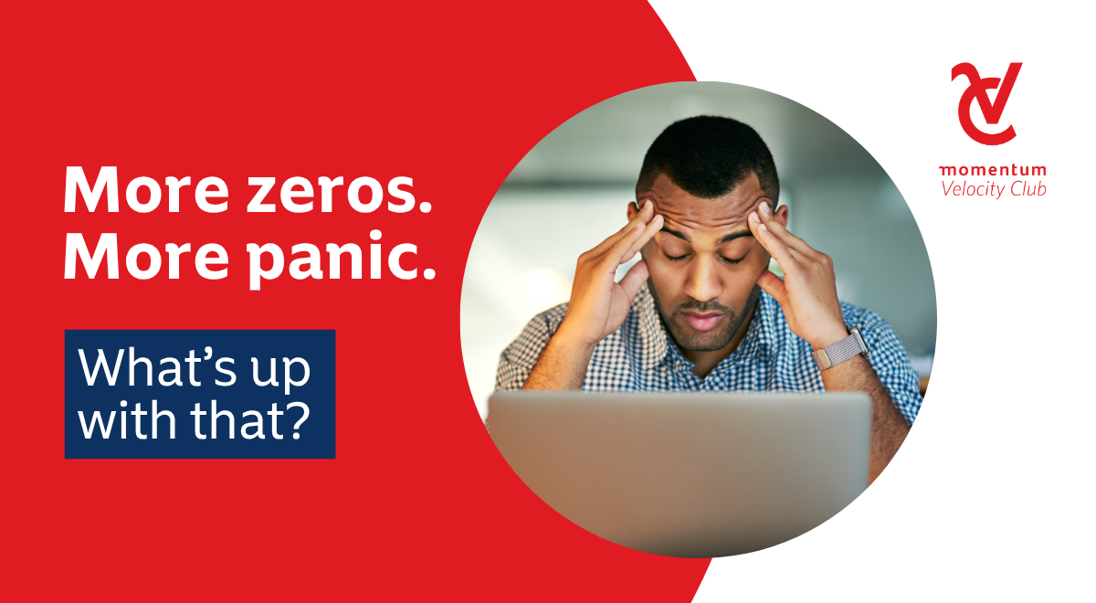 A man is sitting at his laptop with his head in his hands. He looks stressed and overwhelmed about his finances.