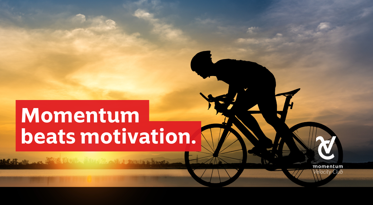 A man riding his bicycle, confident that steady momentum is the key to building long-term wealth.