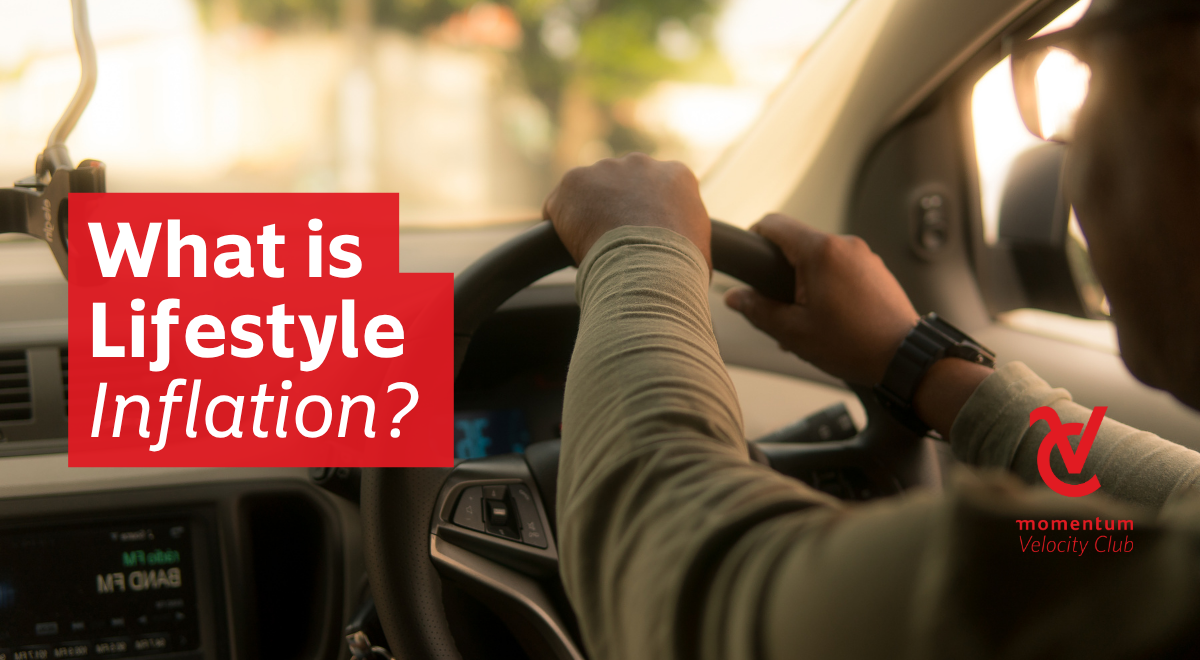 A man is driving with both hands on the steering wheel.