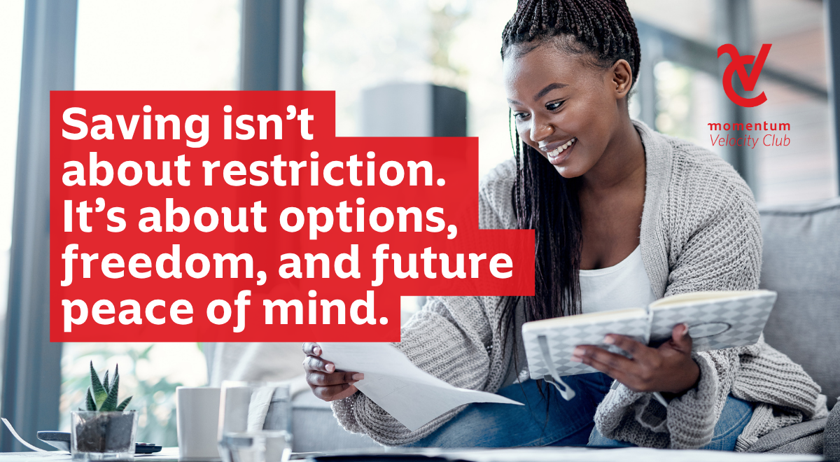 A woman sits holding her diary planning her freedom and financial peace of mind.